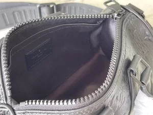 LOUIS VUITTON KEEPALL BANDOULIÈRE 25 BAG TAURILLON MONOGRAM - WLM555