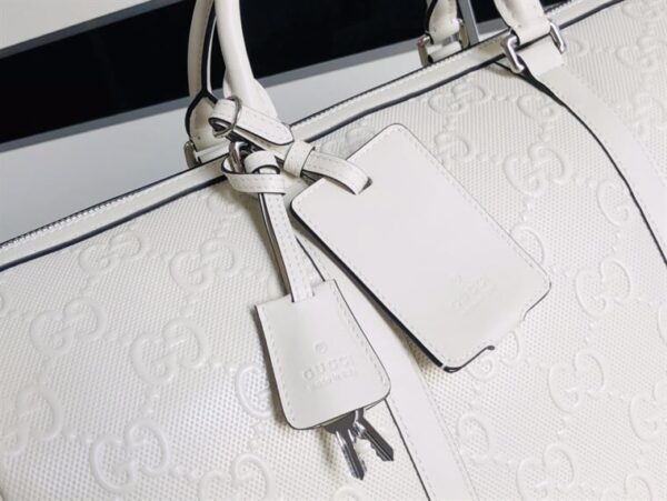 GUCCI GG EMBOSSED DUFFLE BAG - GC59